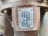 a close up of a rusted metal object on the ground