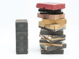 a stack of books sitting on top of each other