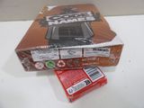 a box of cigarettes sitting on a table next to a box of cigarettes