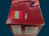 a box of legos sitting on a blue surface