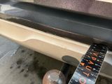 a close up of a car ' s bumper with a tape attached to it