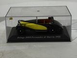 yellow and black model of a car in a clear display case