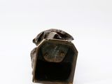 bronze statue of a man with a dog ' s head in a box