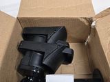 a box that has a black object inside of it