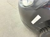 a close up of a black car with a sticker on it