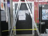a picture of a kitchen with a ladder in the middle of the room