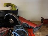 some tools are sitting on top of a wooden table
