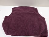 purple flee vest on a white table with a white background