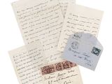several old letters and envelopes are stacked on top of each other