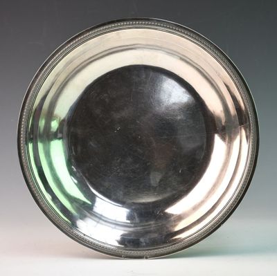 a silver plate that is sitting on a table