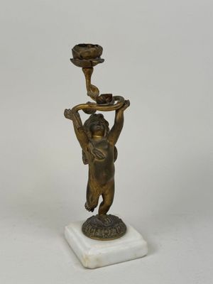 bronze figurine of a woman holding a flower pot on a marble base