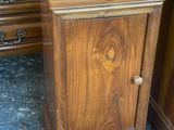 a wooden table with a vase of flowers on top of it