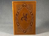 an old book with a picture of a bird on it