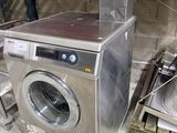 a washer and a dryer sitting in a warehouse