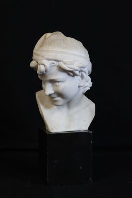 a white marble bust of a woman with a hat on her head