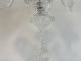 a glass chandelier hanging from the ceiling