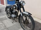 a motorcycle that is parked on the side of the street