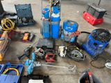 a lot of tools that are sitting on the floor