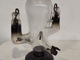 a glass lamp that is on top of a table