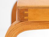 a close up of a wooden table on a white background