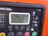 a close up of a control panel on an orange wall