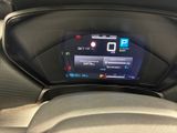 the dashboard of a car with a digital display in the center