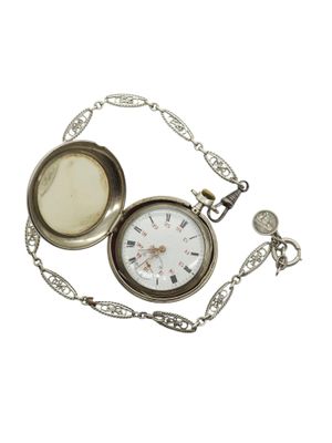 a pocket watch with a chain around it on a white background