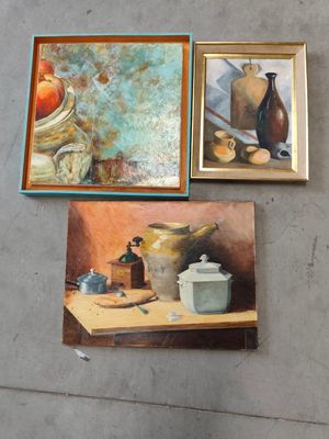 three paintings on a wall of a kitchen with pots and a teapot
