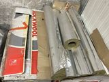 a box of rolls of insulation next to a box of rolls of insulation