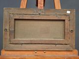 an old wooden easel with an empty canvas on top of it