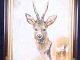 une photo d'un tableau représentant un cerf posé sur un chevalet