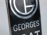 un panneau sur lequel est écrit « George's Irat »