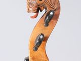 a close up of a violin neck with the back end of a violin