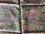 green and pink silk scarf with paisley design