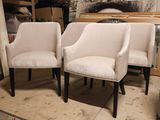 two chairs sitting next to each other in a room