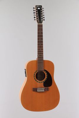 a close up of a guitar hanging from the ceiling