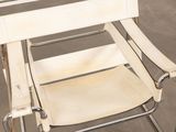 a white chair that is sitting in a room