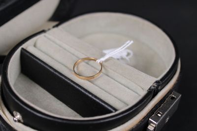 a ring in a case with a ring on top of it