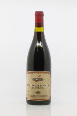 an image of a bottle of red wine on a white surface