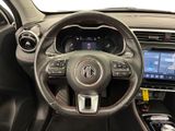 the interior of a car with a steering wheel and dashboard controls