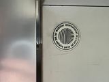 a close up of a refrigerator with a sticker on it