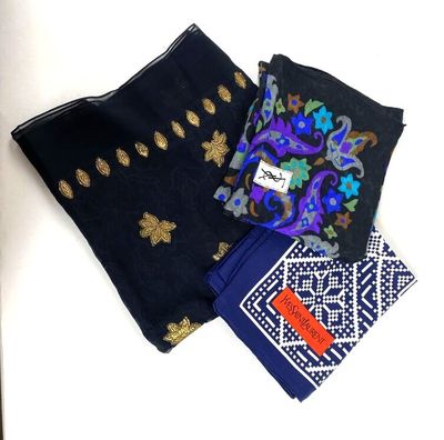 several different types of scarves are laid out on a white surface