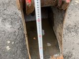 a measuring tape on the side of a red fire hydrant