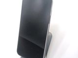 a cell phone that is sitting on top of a stand