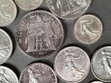 a lot of coins that are on the table