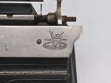 a close up of a typewriter with a logo on it