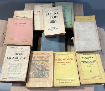 a lot of books that are sitting on top of a table