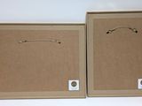 two cardboard boxes with handles and handles are shown on a white background