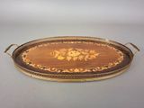 an image of a wooden tray with a floral design on it