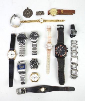 a lot of watches that are laying out on the table